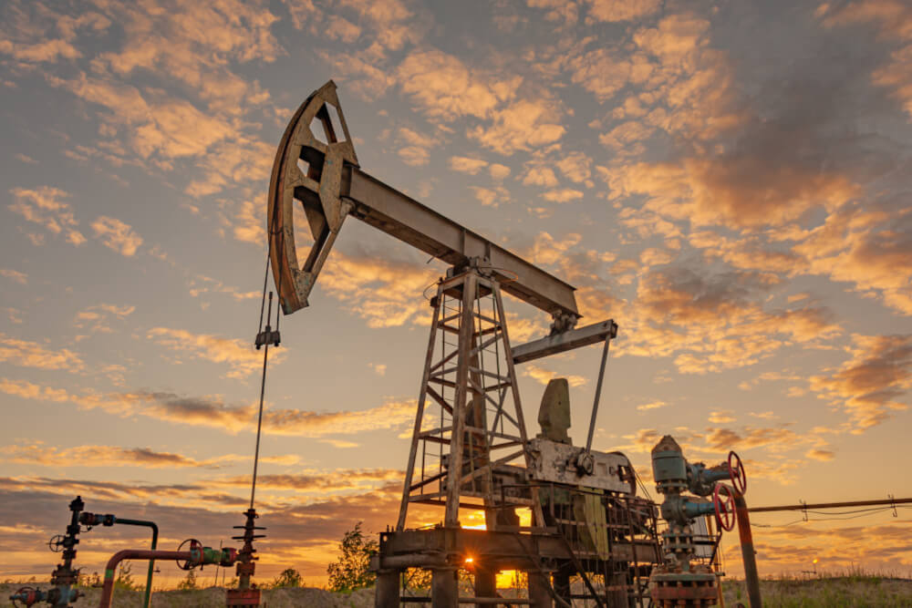 An Upward Photo of an Oil Derrick