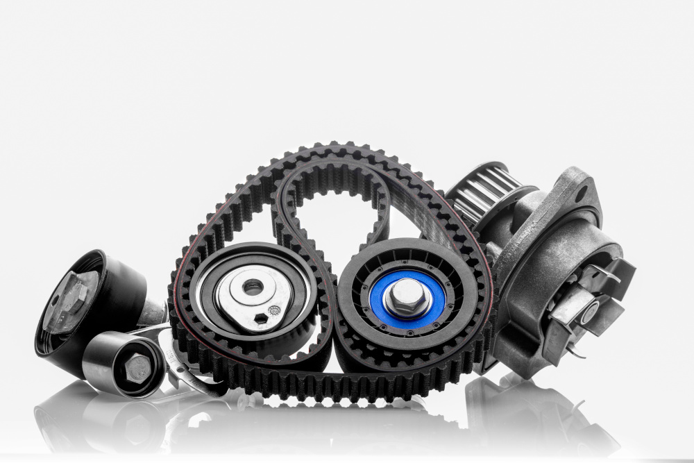 A full drive belt kit with pulleys and a belt.