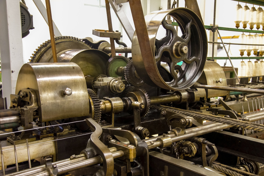 A flat belt pulley in an old textile machine.